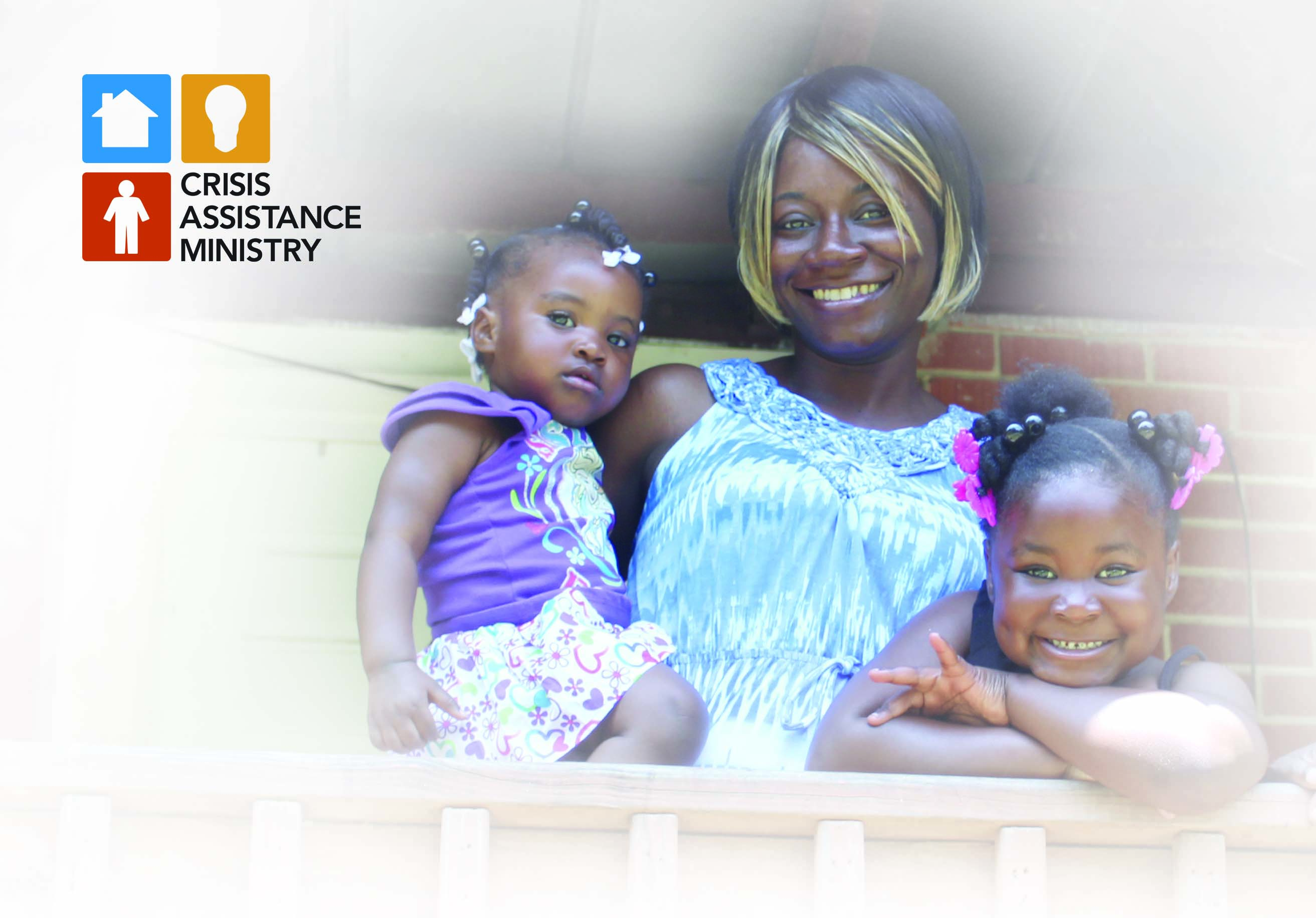 Smiling family on a porch with logo